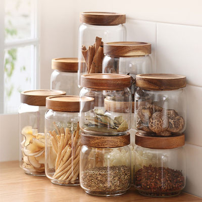 Op maat gemaakte capaciteit voorraad verzegeld helder rond borosilicaat glas verpakkingscontainers pot met houten deksel